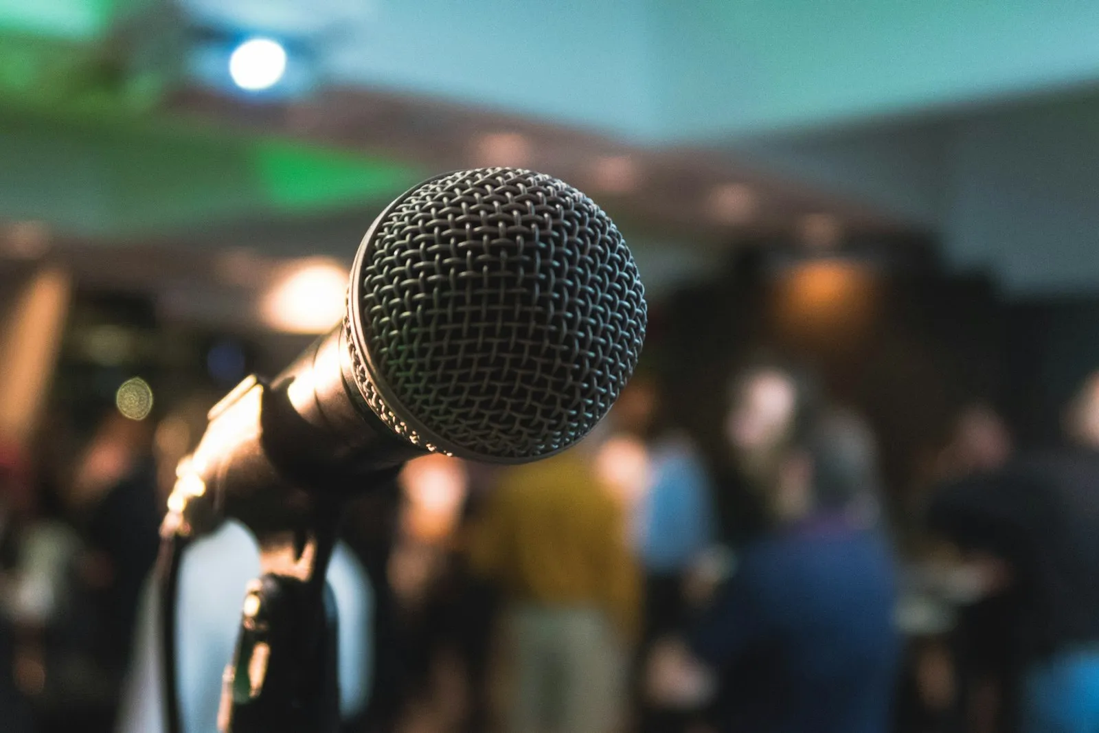 An event professional managing a live session from the side of the stage
