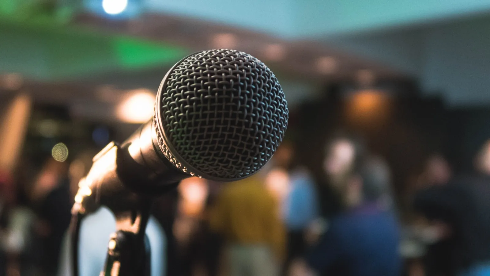 A speaker on stage during a live session that a run-of-show has already timed