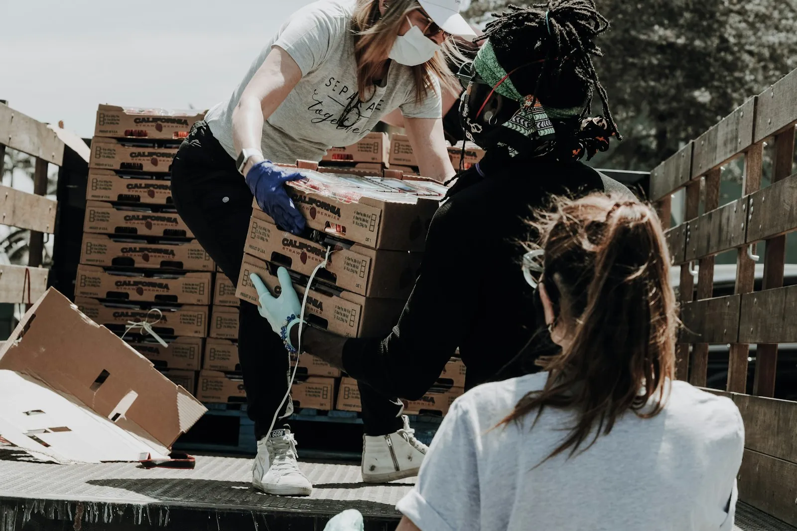 Nonprofit volunteers coordinating an event with donated goods